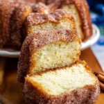 Sliced Cinnamon Sugar Donut Bread served on a wooden board