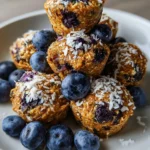 Baked lemon blueberry protein bars with fresh blueberries and lemon zest