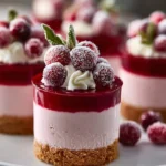 Delicious cranberry mousse cups garnished with fresh cranberries
