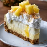 Delicious Coconut Pineapple Cheesecake topped with tropical flavors.