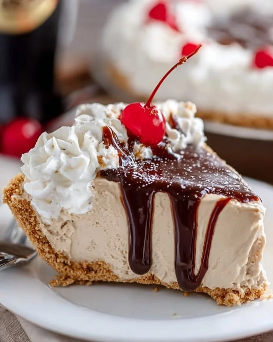No-Bake Dr Pepper Pie topped with whipped cream and cherries